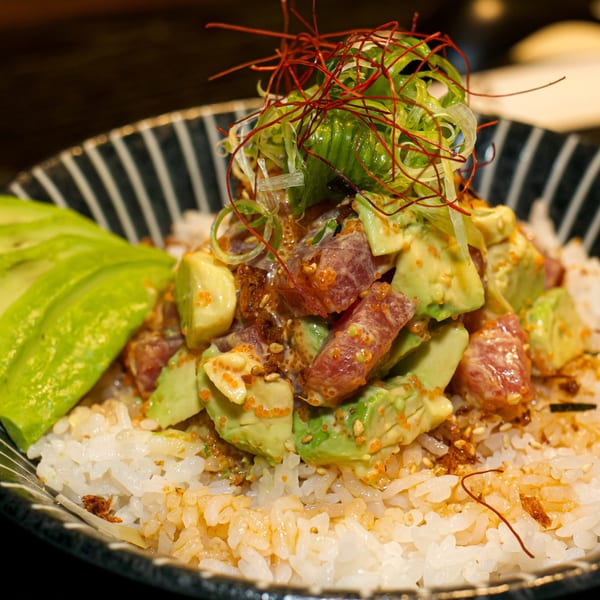 Boru Ramen's poke bowl with tuna, avocado, roe, and scallions over white rice.